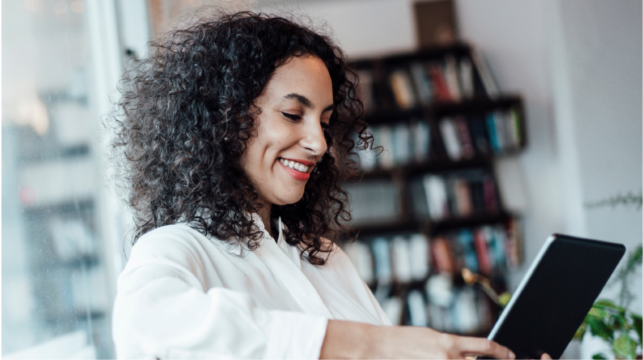a women reading an IPad