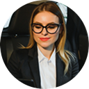 A portrait of participant persona Carla, a patient services coordinator managing debt while saving for retirement and college with financial wellness support.