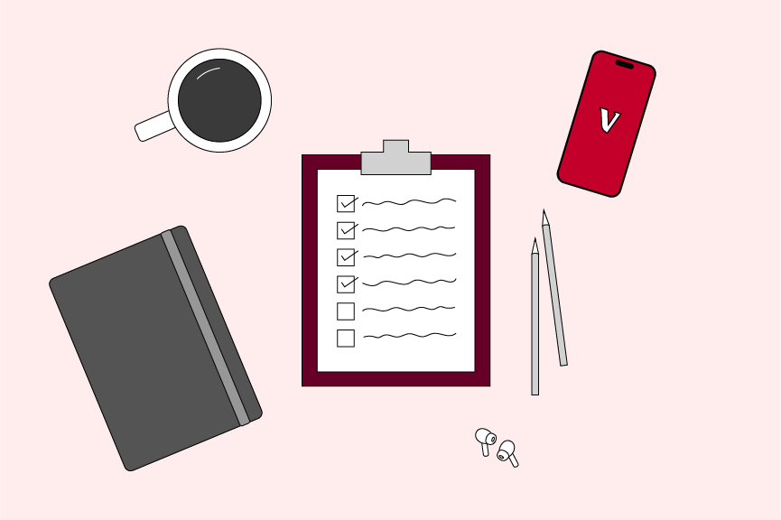 clipboard, coffee cup, phone, writing utensils and planner