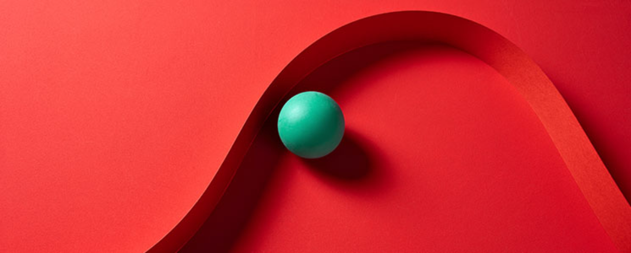 green ball on red background