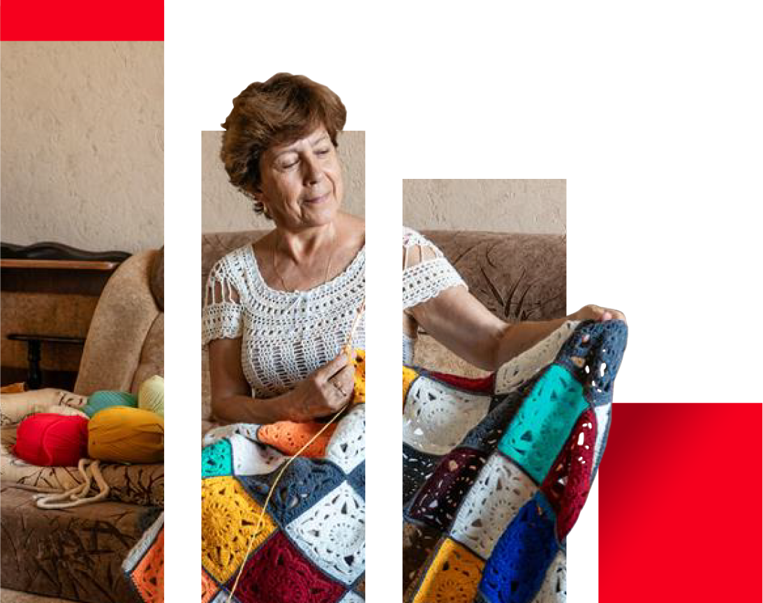 a woman sitting on a couch knitting
